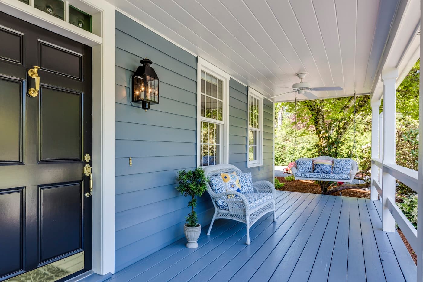 A porch with two chairs and a table, warm and inviting