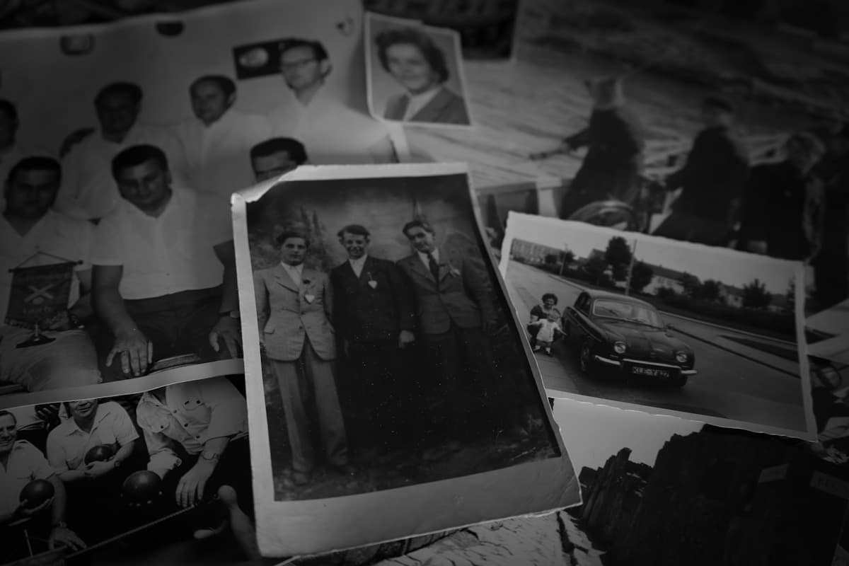 Old photographs scattered across a surface, evoking cherished memories and stories waiting to be told