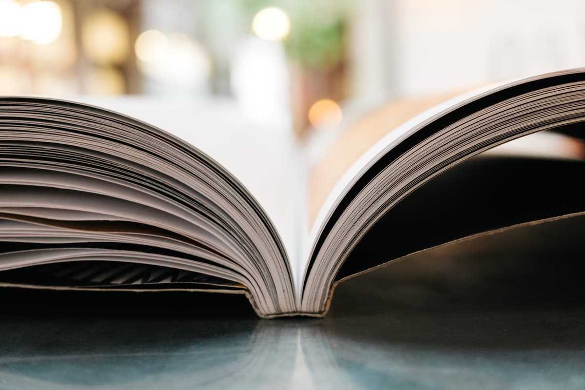 Bokeh photography of an open book with warm soft light